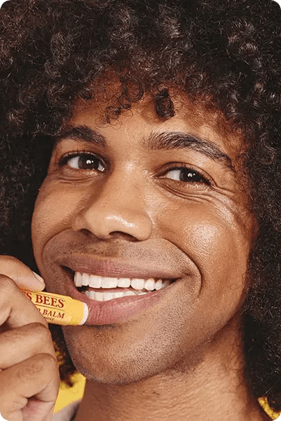 man using burt's bees lip balm